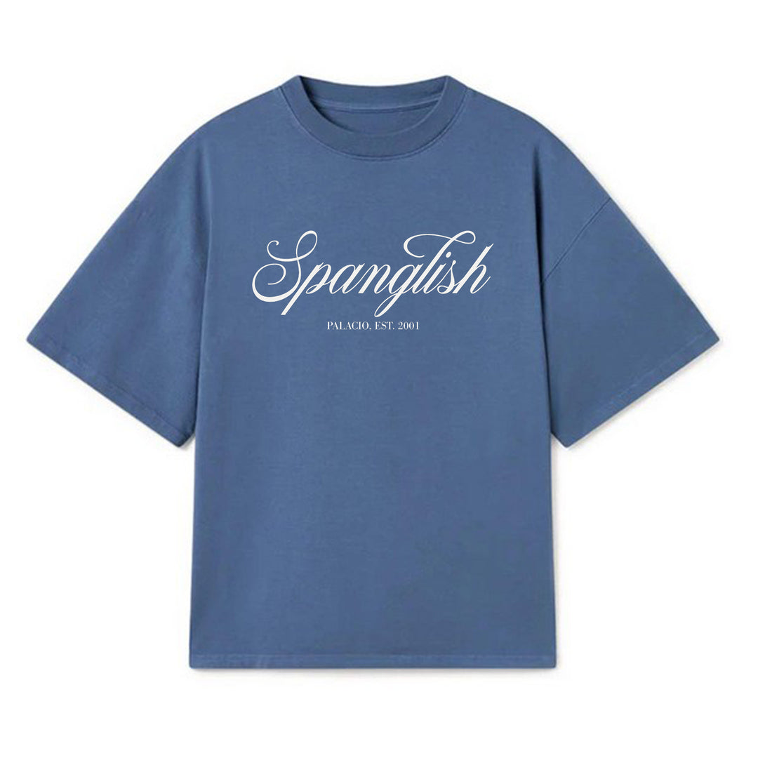 A blue Micah Palace Max Heavyweight short-sleeve tee featuring "Spanglish" in bold white script and "PALMOQ. EST. 2001" in smaller print on the front.