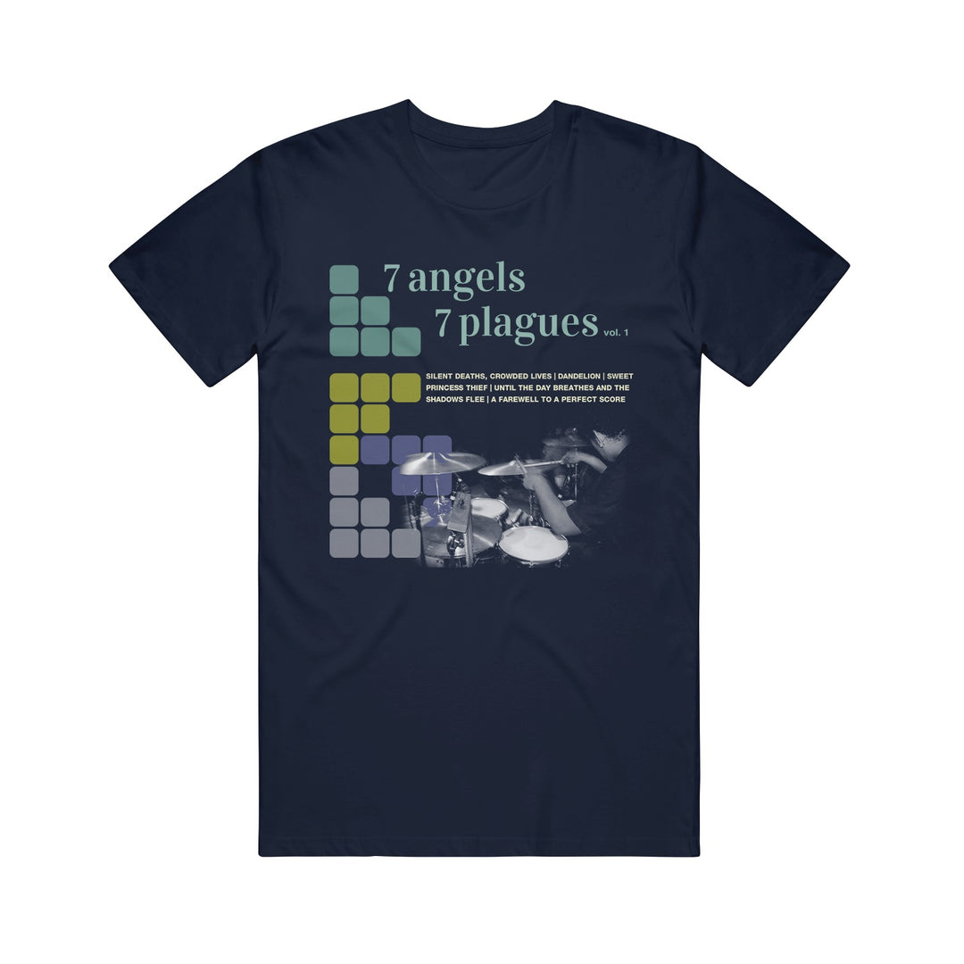 Navy blue 7 Angels 7 Plagues t-shirt featuring "vol. 1" text, colored squares, a grayscale drummer photo, and band names below the title.