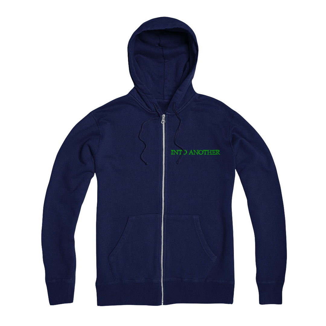 A classic Into Another Navy Zip Up hoodie with front pockets, bold green "INTO ANOTHER" logo on the left chest, and a subtle Purple Star accent for added style.
