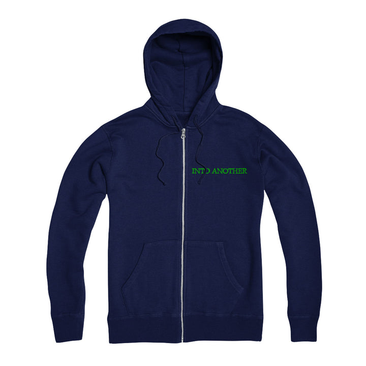 A classic Into Another Navy Zip Up hoodie with front pockets, bold green "INTO ANOTHER" logo on the left chest, and a subtle Purple Star accent for added style.