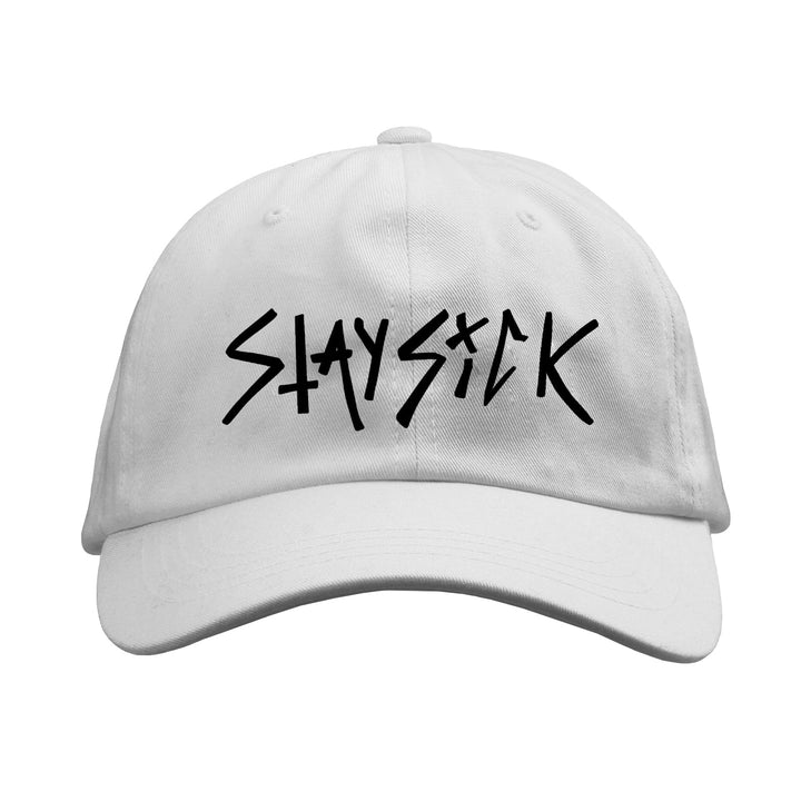 A white Dad Hat from Stay Sick Clothing featuring bold, black graffiti-style STAYSICK lettering on the front—a standout Scratch Logo design for a statement look.