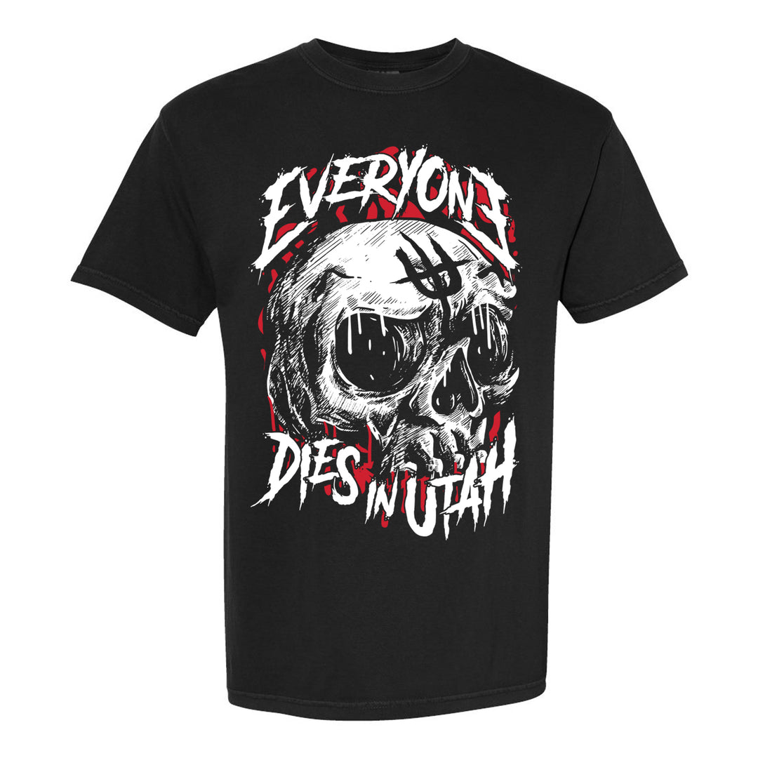 A black Comfort Colors t-shirt from Everyone Dies In Utah featuring a distressed skull with red accents and jagged “Everyone Dies in Utah” text above and below the graphic.