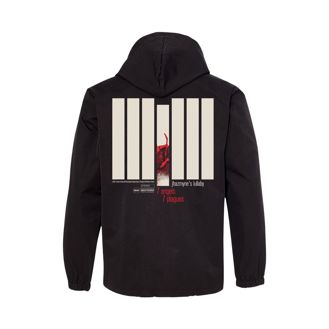 Black water-resistant windbreaker by 7 Angels 7 Plagues with a large back graphic: seven beige vertical bars, red-toned abstract image, and "7 angels 7 plagues" plus "Jazzyanne’s lullaby" in white and red. Direct to film transfers.