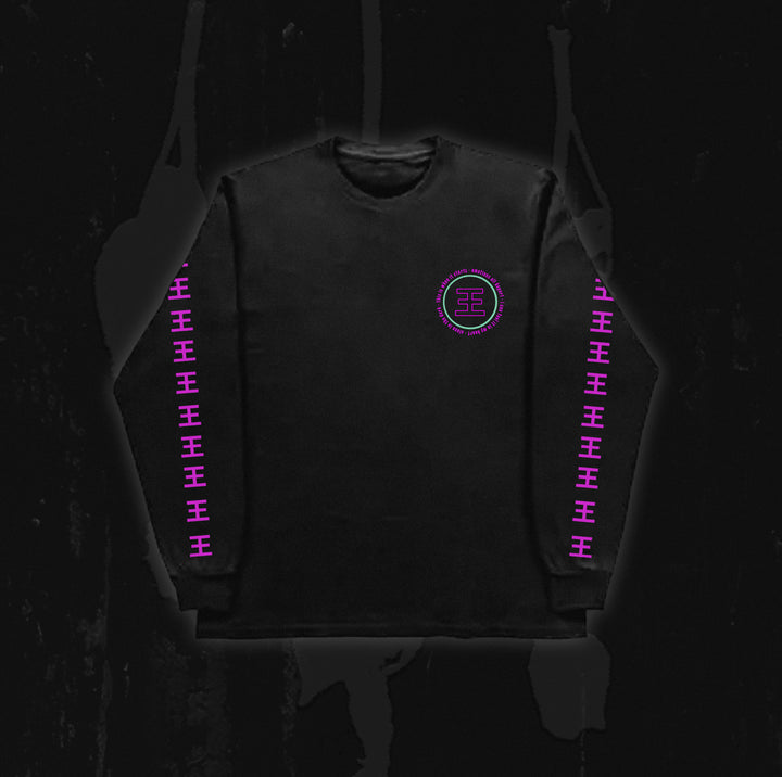 A black long-sleeve shirt from Reflections, featuring a pink geometric Crystal Eyes logo on the chest and repeating pink symbols down both sleeves, displayed against a dark background.