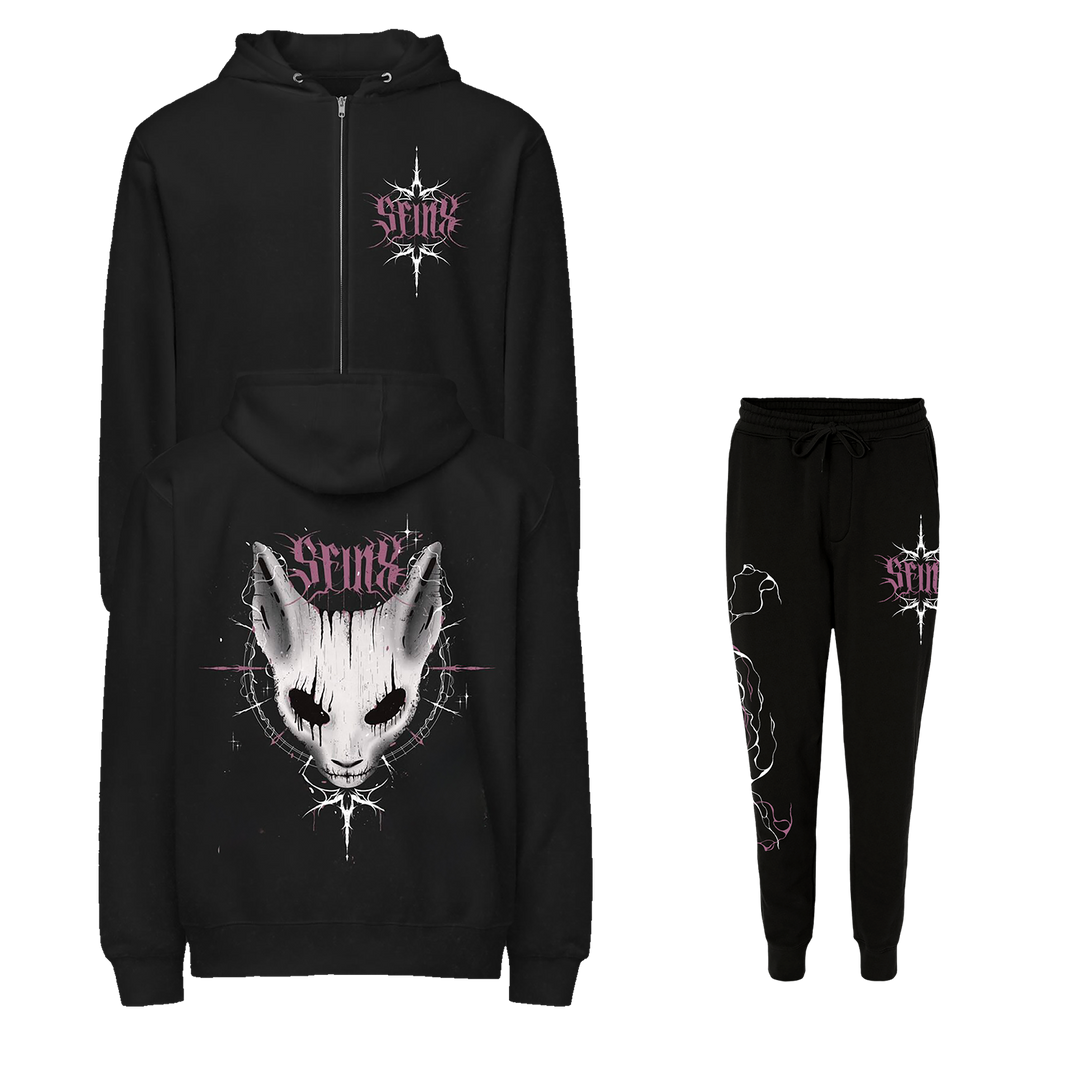 SFINX black hoodie and sweatpants set with a gothic white cat face and silver starbursts. Hoodie has cat graphic on back, PRINX text on chest; sweatpants feature matching logo and small cat design.