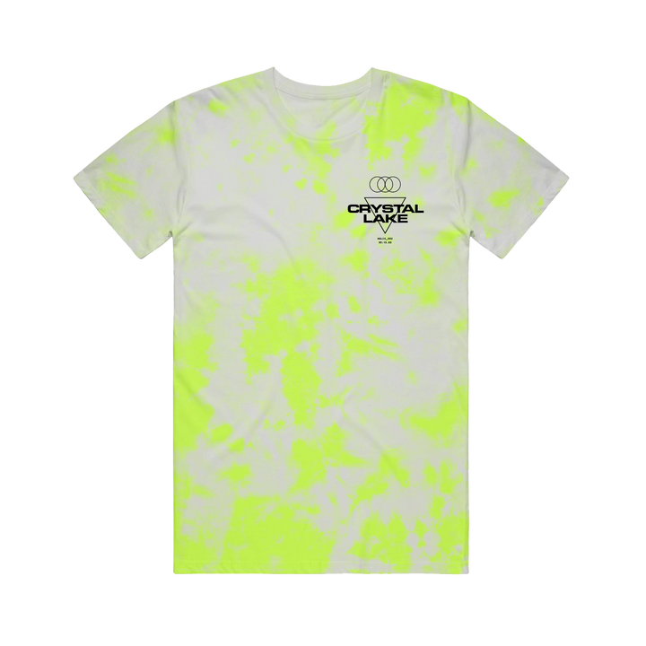 A white Crystal Lake t-shirt featuring bright yellow tie-dye patterns and a small black logo with overlapping rings on the left chest, displayed flat against a plain white background.