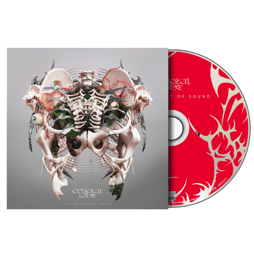 A Crystal Lake CD and its case are shown. The case features abstract, symmetrical bone and anatomical art with a mirrored DYSTOPIA design. The red CD displays white, flame-like patterns and partially visible writing.