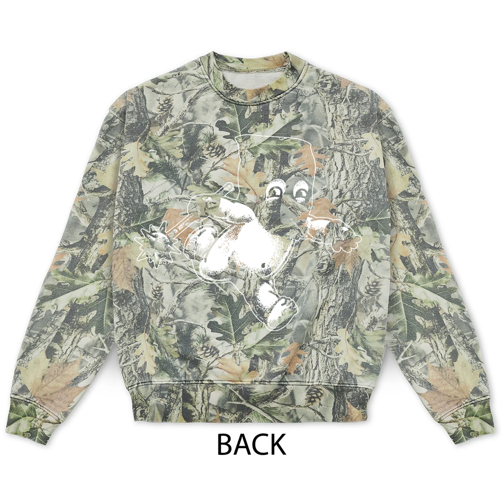 Vintage wood camo crewneck sweatshirt in a tree bark and leaf print, featuring a white graphic of a Jackal Kewpie character on the back.