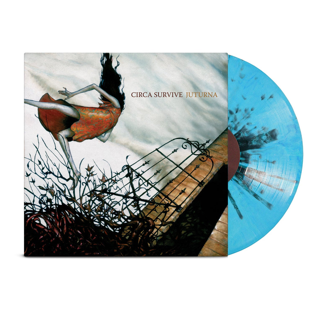 The Circa Survive Juturna vinyl features cover art of a woman in a red dress with windblown hair leaning over thorny branches, alongside a limited edition pale blue and black splatter record partially inside its sleeve.
