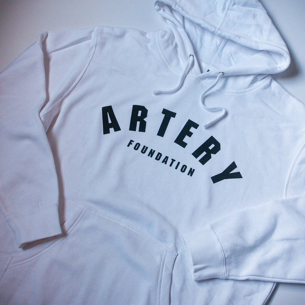 This classic-fit white hoodie by Artery Foundation is crafted from ring-spun cotton fleece and features "ARTERY" in bold black letters with "FOUNDATION" in smaller print beneath on the front.