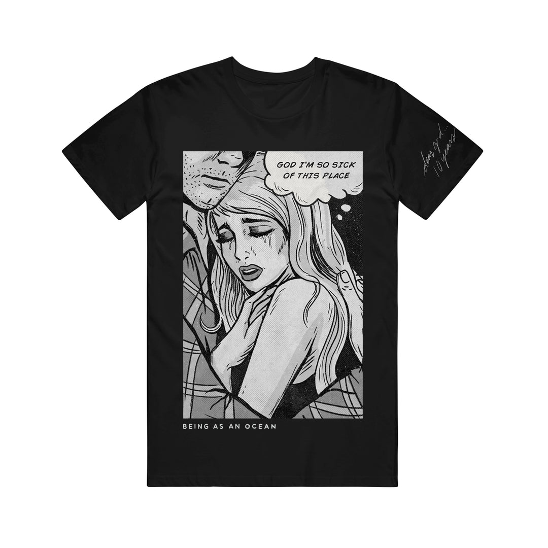 image of a black tee shirt on a white background. tee has a full body print in white of a man holding a crying woman in comic book type art. the woman has a text bubble that says "God I'm so sick of this place". on the bottom left says being as an ocean