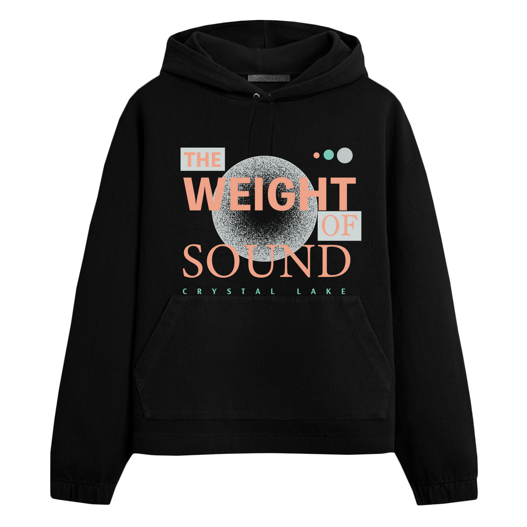 A black Crystal Lake hoodie with a front pocket features THE WEIGHT OF SOUND text, bold fonts, geometric shapes, and a textured circle in light gray, peach, and mint—perfect for fans of custom apparel.
