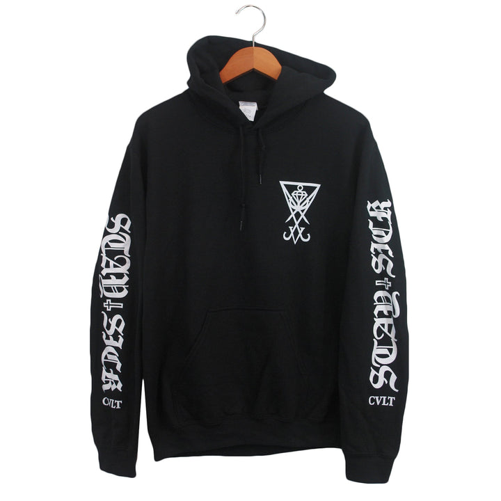 A black Stay Sick Clothing hoodie with white graphics: a geometric symbol on the chest, IN DIST HORDS down both sleeves, and CVLT near the left wrist, displayed on a wooden hanger.