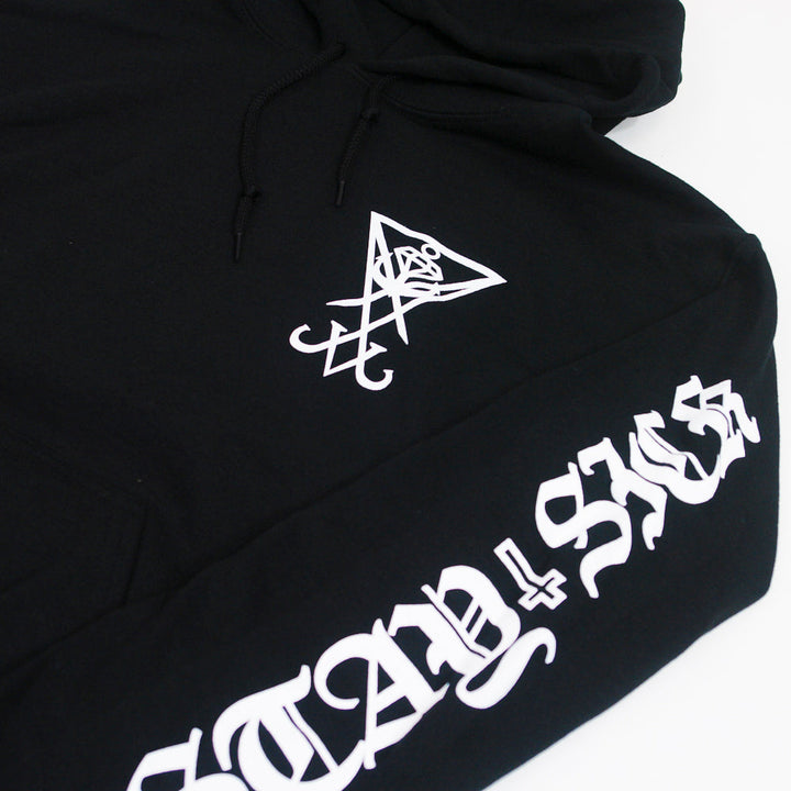 Stay Sick Clothing black hoodie with a white geometric symbol on the chest and “STAY SICK” in bold, ornate white lettering down the sleeve.