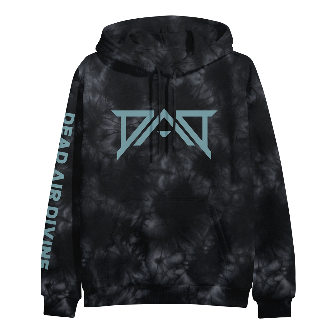 A black ring-spun cotton tie dye pullover hoodie by Dead Air Divine, featuring a blue geometric chest logo and DEAD AIR DIVINE in blue block letters running vertically down the left sleeve.