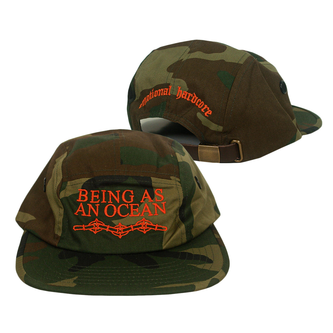 Camo five-panel cap with BEING AS AN OCEAN and a barbed wire graphic embroidered in orange on the front, and emotional hardcore embroidered on the back.