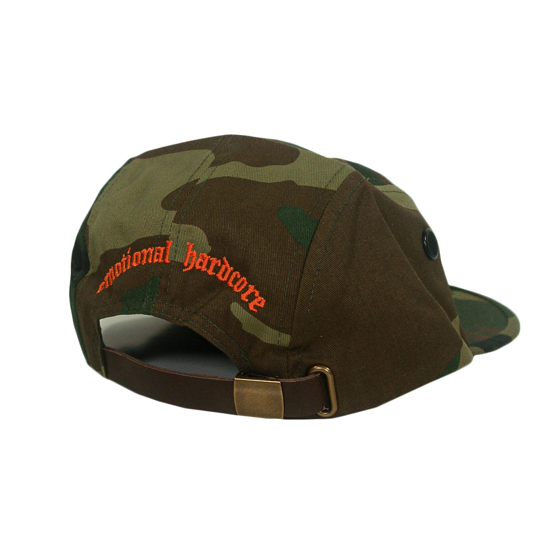 Camo print five-panel cap with emotional hardcore embroidered in orange on the back and an adjustable leather strap.