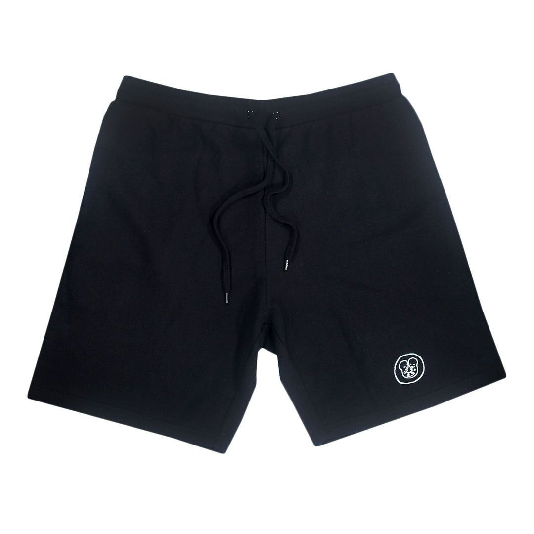 Black athletic shorts with a drawstring waistband and a small white logo near the left hem, displayed on a plain white background.
