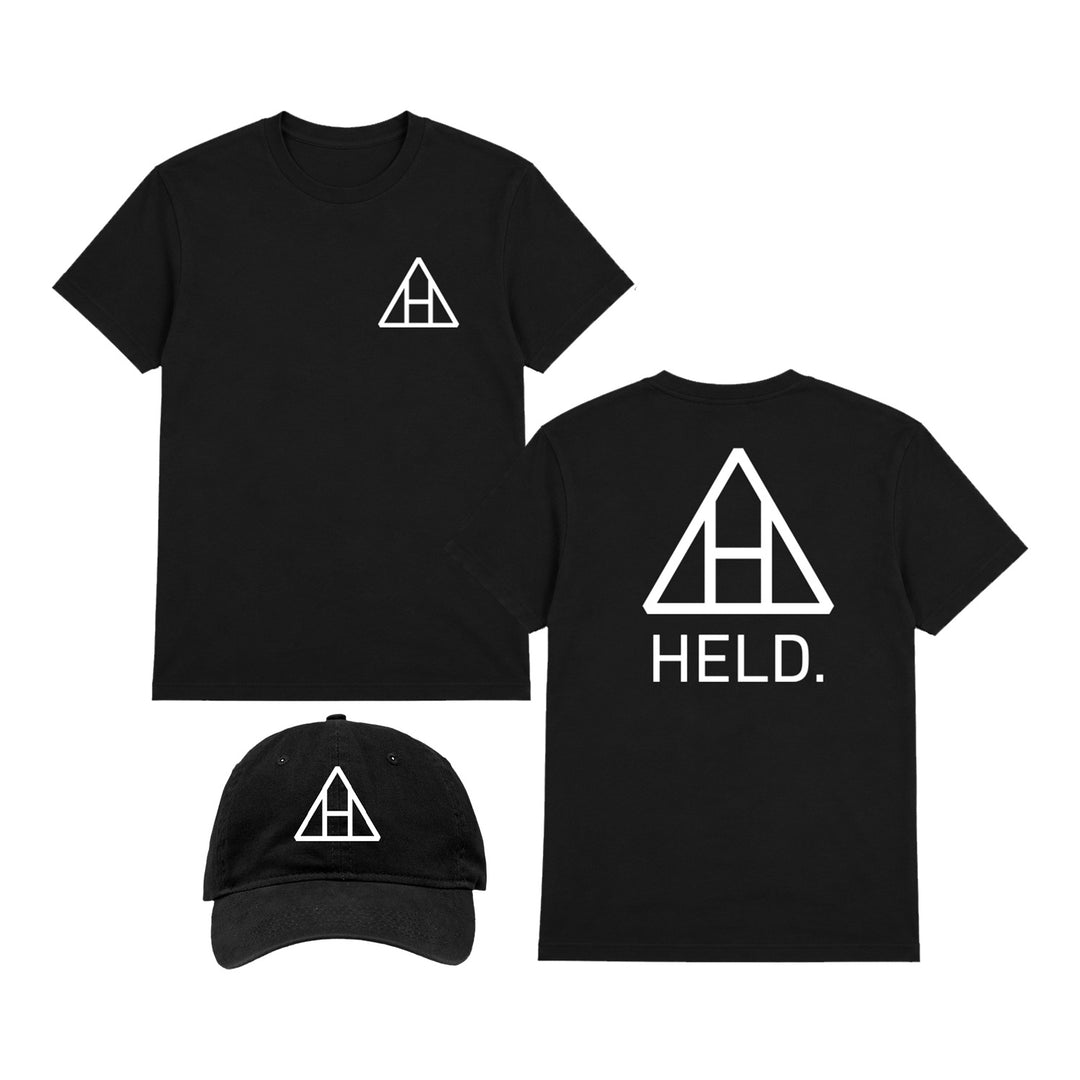 Black printed tee and cap set with white geometric logo, crafted on premium Comfort Colors fabric. The shirt shows a small logo on the front and a large logo with HELD. on the back, while the cap features the same logo prominently displayed on the front. All items are laid out for display.