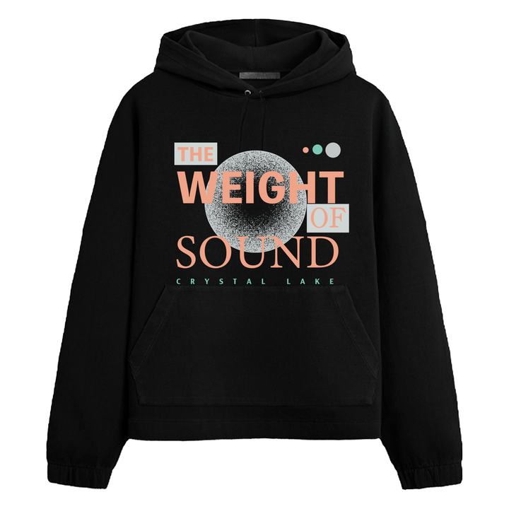 A black Crystal Lake hoodie with "THE WEIGHT OF SOUND" in bold peach and white letters, "CRYSTAL LAKE" in teal below, and abstract gray and teal circular graphics above the text.