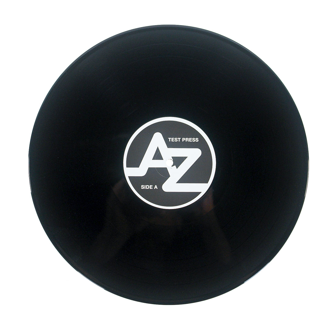 Black New Day Rising test press 12″ vinyl with a white center label featuring a stylized AZ logo, the words TEST PRESS, and SIDE A.