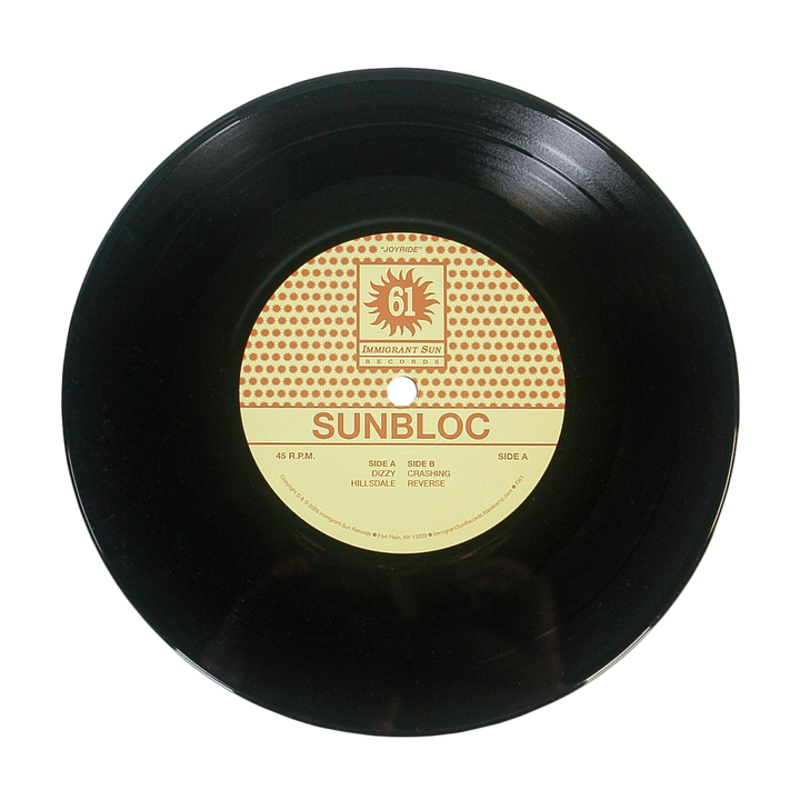 A black vinyl record featuring a yellow and red Sunbloc label with the tracks "HILLSIDE" and "REVERSE," ideal for hardcore and alternative music fans, is displayed on a white background.