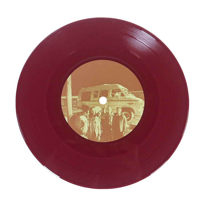 A maroon vinyl record by Sunbloc featuring a sepia center label with people in front of a van—ideal for alternative and hardcore music fans, shown on a plain white background.