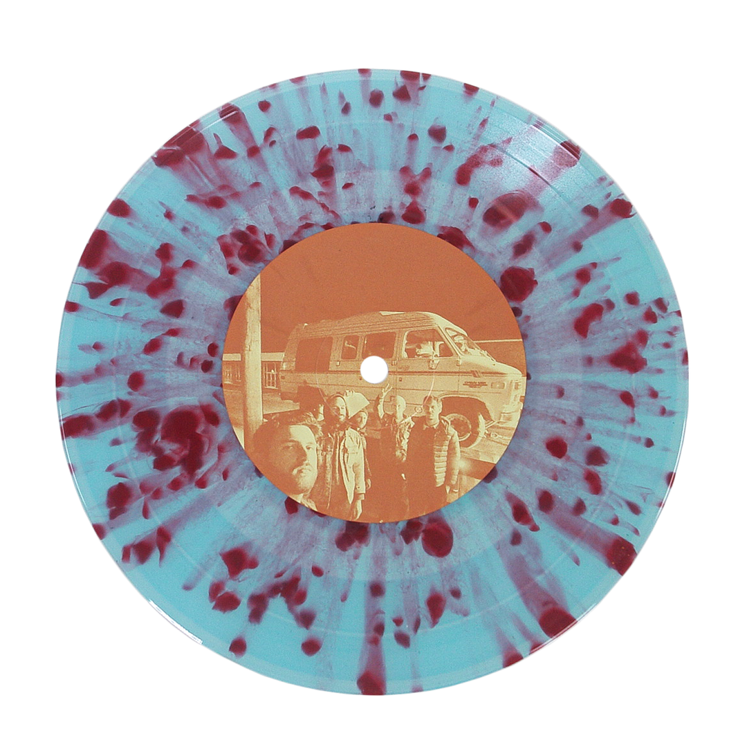 A vinyl record with a pale blue base and dark red splatter pattern. The center label shows a sepia photo of four people before a van, reflecting Sunbloc's alternative music vibe on the Joyride EP.