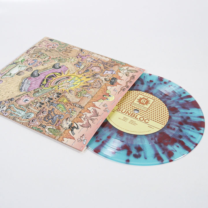 A vibrant vinyl with blue and maroon splatters peeks from a cartoon-style cover of abstract scenes. The label reads Sunbloc, showcasing the Joyride EP—a must-have gem for alternative music fans.