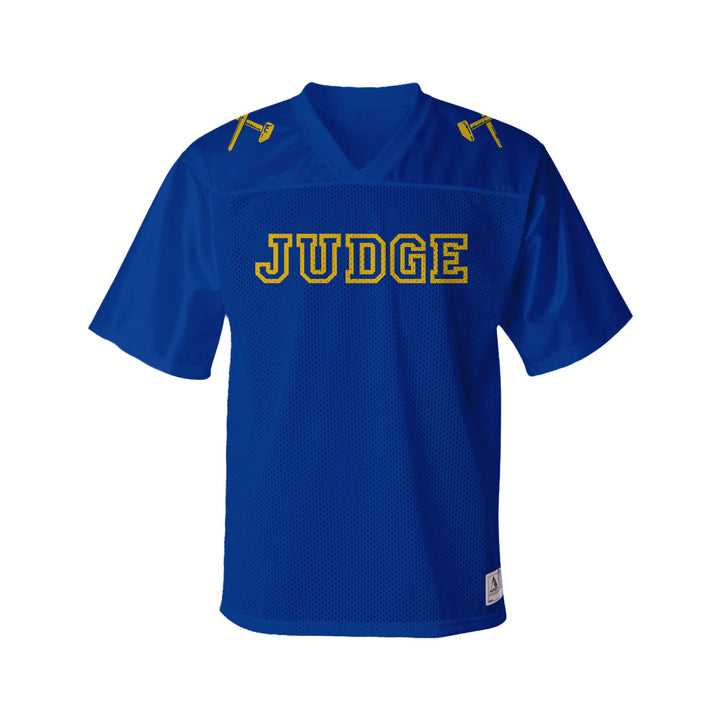 A blue Judge Replica Football Jersey made of polyester tricot mesh, with yellow accents, "JUDGE" in bold yellow on the chest, and yellow gavel icons on both shoulders.