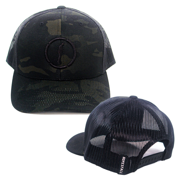 Two views of a black camo mesh trucker hat by Hopesfall: the front features an embroidered circular logo, while the back shows an adjustable snap closure and HOPESFALL text on the mesh.