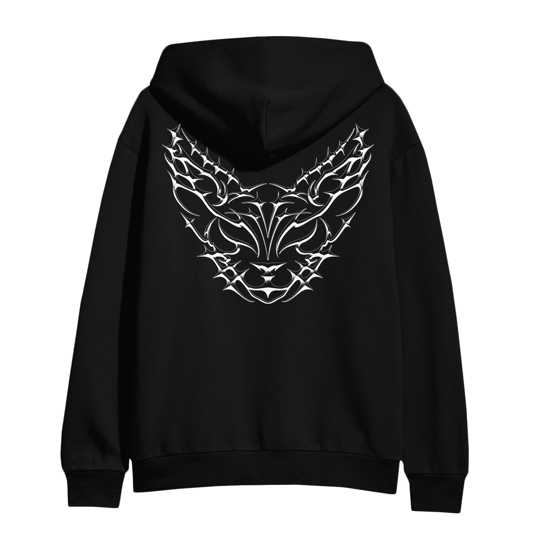 Black hoodie with a hood, featuring an intricate white tribal-style graphic design resembling a stylized animal face on the back.