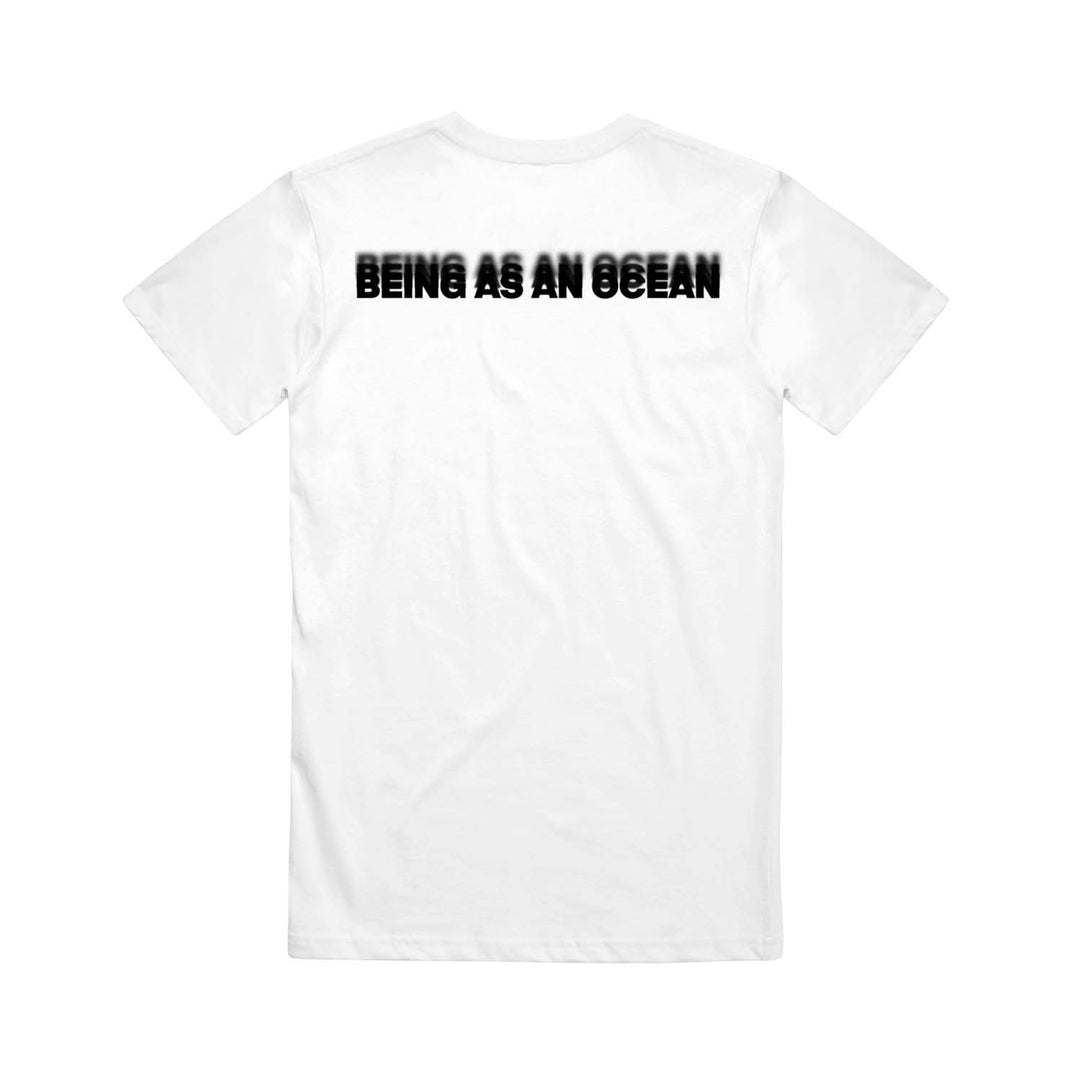 image of the back of a white tee shirt on a white background. the tee has a black print across the top shoulders in blurred text that says being as an ocean.