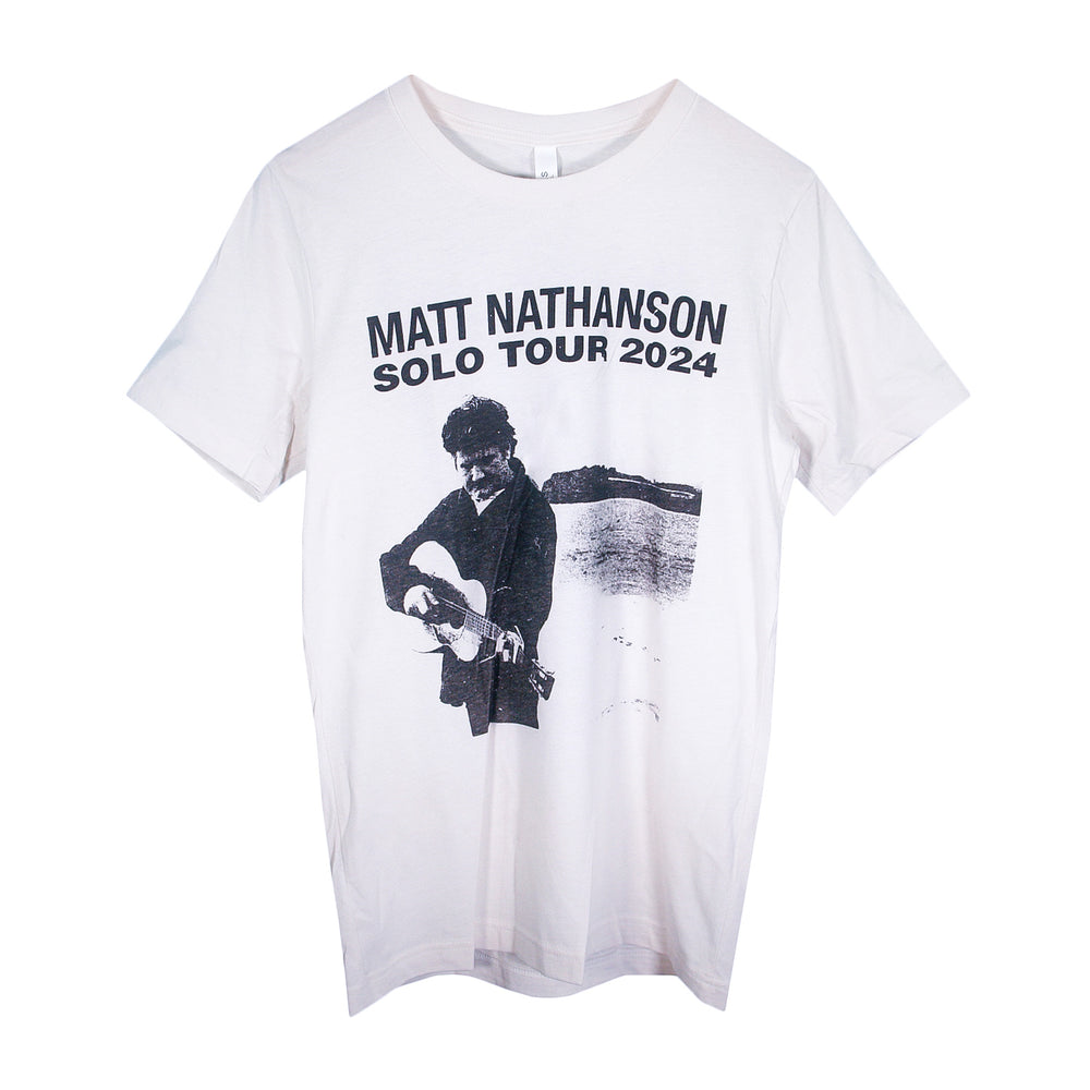 Matt Nathanson white T-shirt with a black-and-white graphic of a guitarist and Solo Tour 2024 text above. A stylish tee for fans of Matt Nathanson.