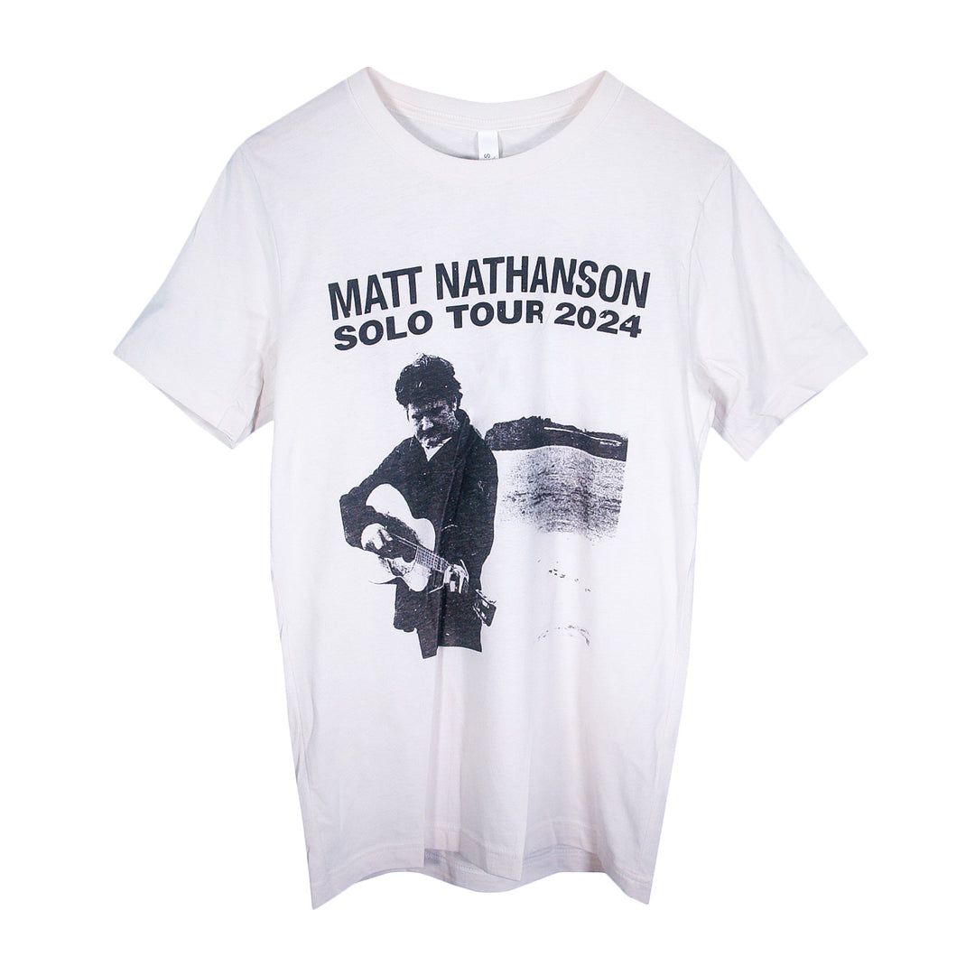 Matt Nathanson white T-shirt with a black-and-white graphic of a guitarist and Solo Tour 2024 text above. A stylish tee for fans of Matt Nathanson.