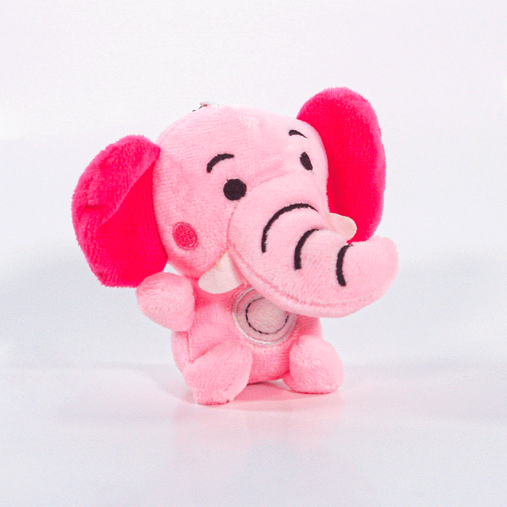 The Pink Elefants plush toy is a cute pink elephant with large floppy ears, a smiling face, and stitched details, displayed against a plain white background.
