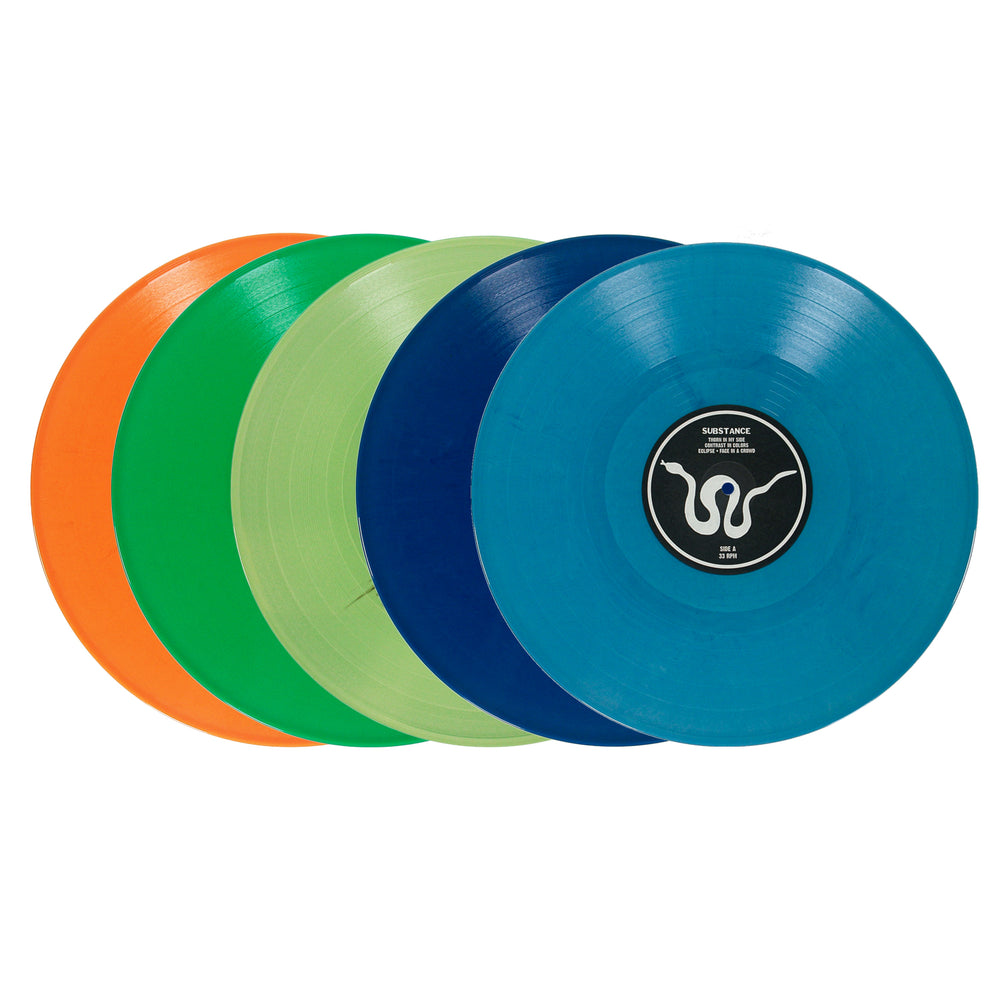 Five colorful vinyl records—orange, green, light green, dark blue, and blue—are stacked slightly offset. The blue record is in the front, displaying a black and white label with a stylized logo. Presented in a reverse board printed jacket and protected by a crystal clear polypropylene outer sleeve, this collection brings striking visual appeal to your vinyl library.