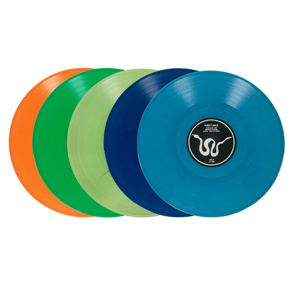 Five vinyl records in shades of orange, green, light green, dark blue, and teal, with a black center label featuring a white snake illustration and the text Thorn In My Side and Eclipse.