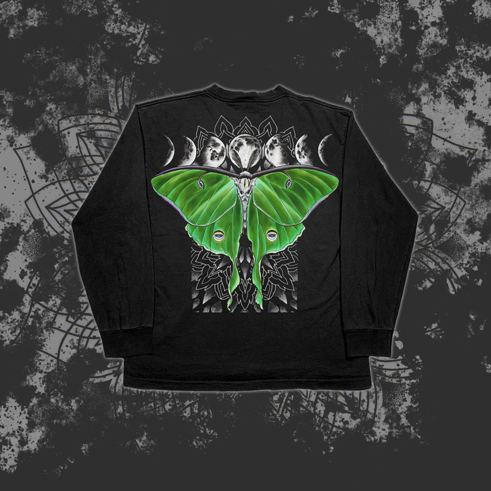 A Reflections long-sleeve shirt with a large green Luna moth, geometric patterns, and lunar phases printed on the back over a textured abstract background.
