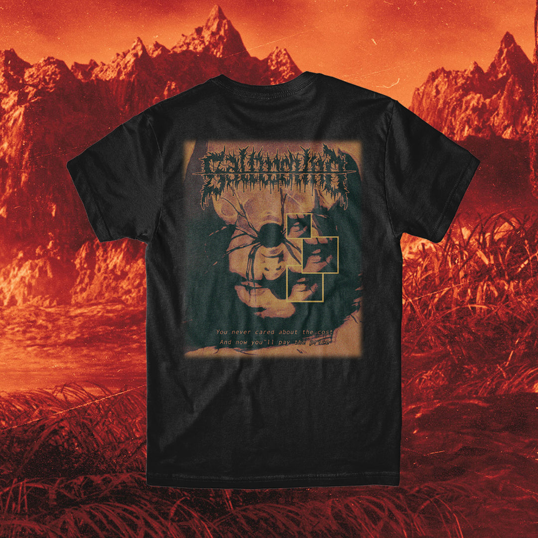 Saltwound black t-shirt in 100% cotton featuring a graphic of a robed figure with scythe, bold text above, smaller text below, and a red mountain backdrop. Relaxed fit inspired by classic American Apparel tees.