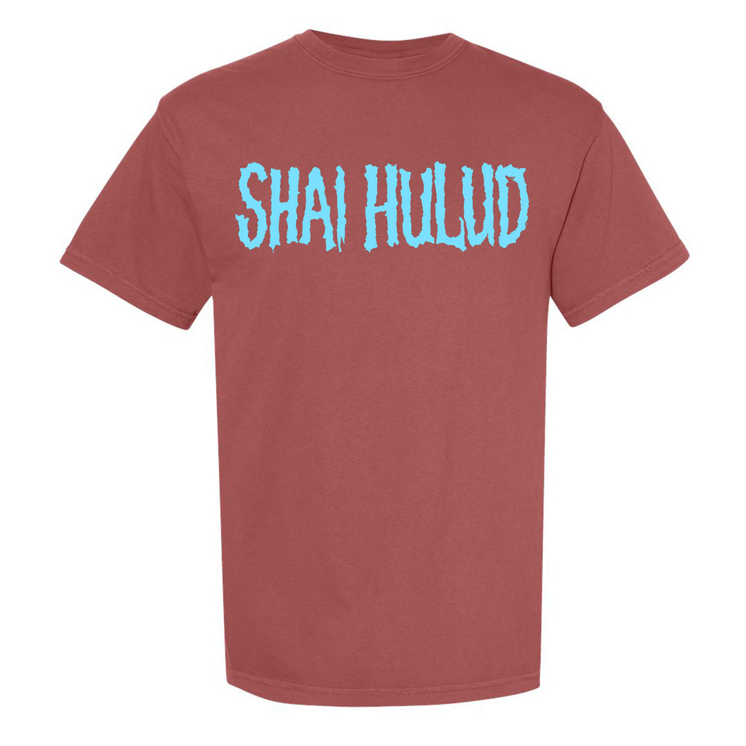 A brick color Comfort Colors t-shirt by Shai Hulud featuring large, light blue, textured SHAI HULUD lettering across the chest.