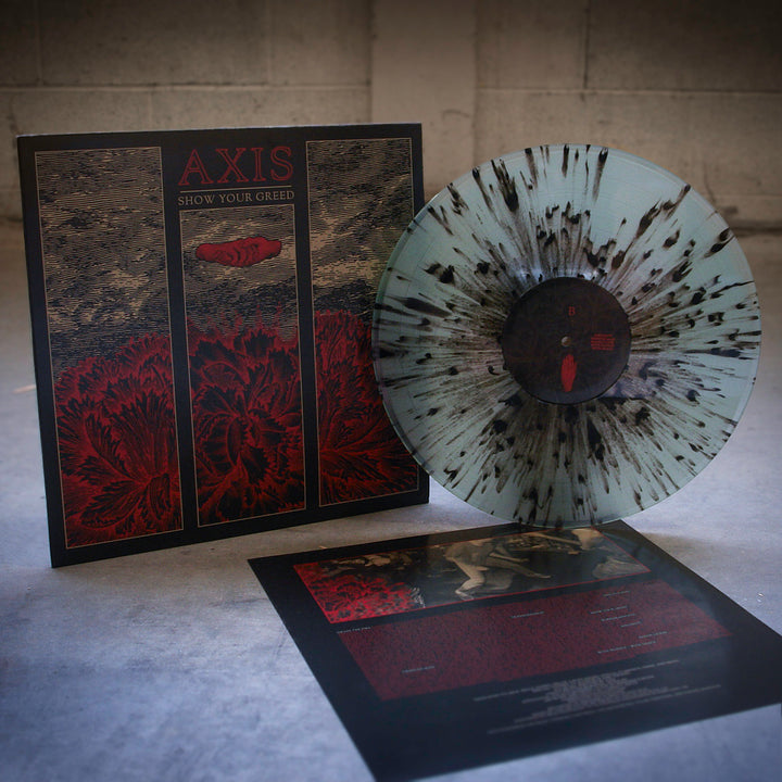 A translucent vinyl record with black splatters is displayed beside its Axis "Show Your Greed" album cover, which features red and black floral art. An insert with track info, including "Sincerity Crippled Man," is placed in front.