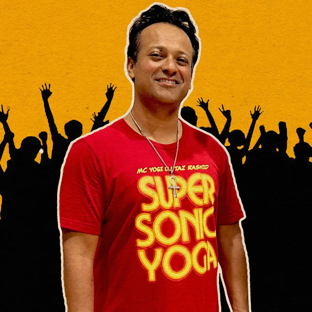 Man wearing a red 'Supersonic Yoga' t-shirt with a yellow text against a yellow and black silhouette background.