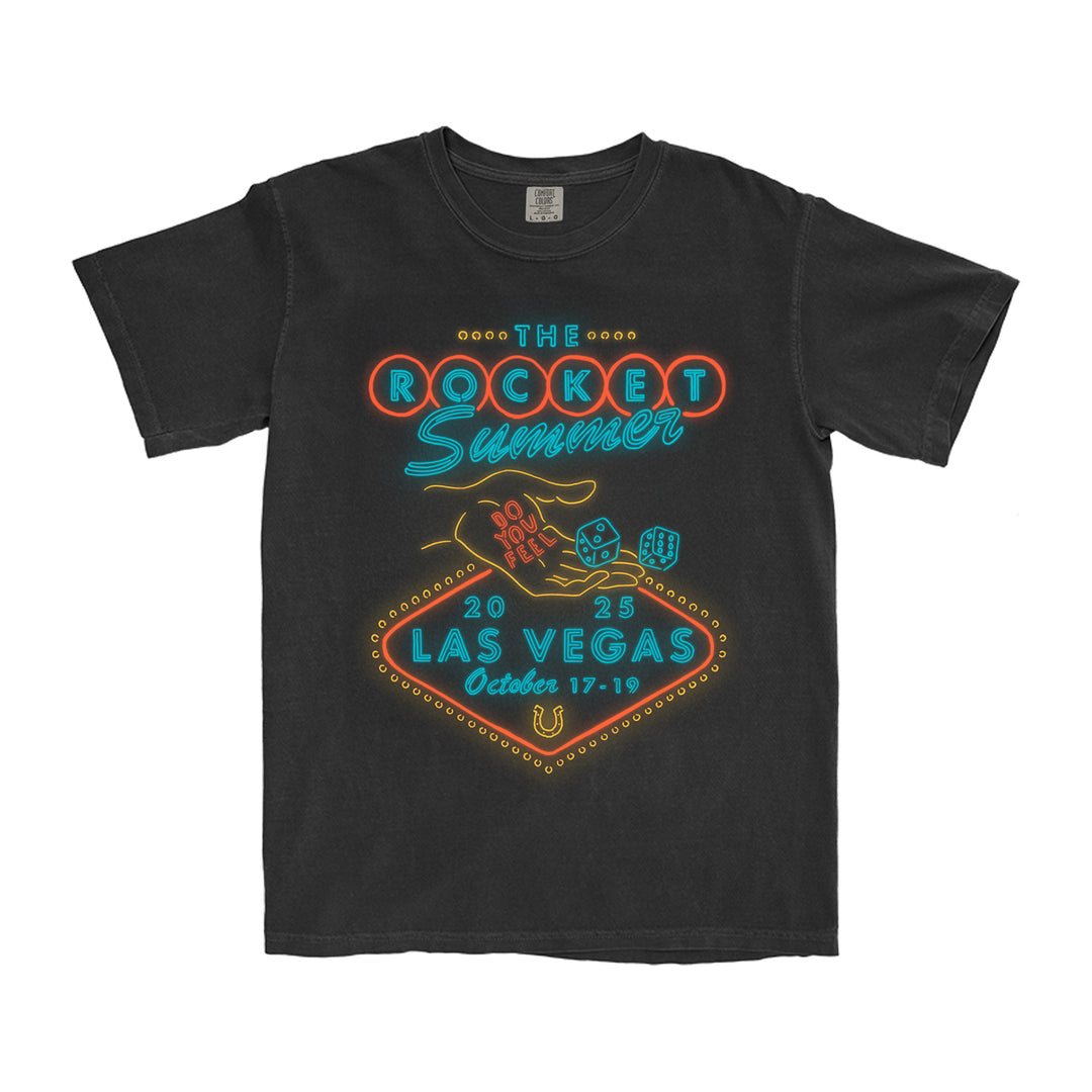 The Rocket Summer black T-shirt, crafted from soft ring-spun cotton, features a neon casino sign-inspired design with dice, poker chips, and Las Vegas 2023 dates.