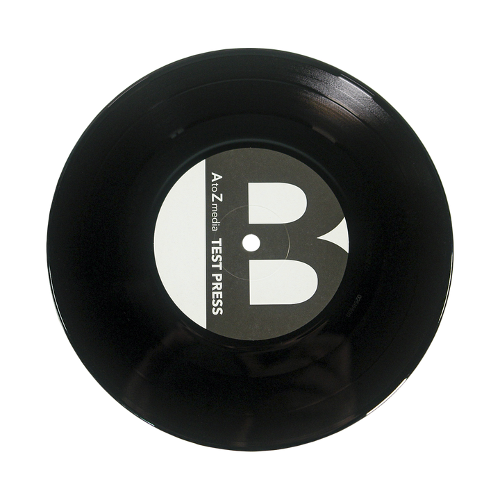 A black Sunbloc vinyl record with a central white and gray label reading "TEST PRESS" in bold, evoking the raw edge of alternative music, displayed on a plain white background.