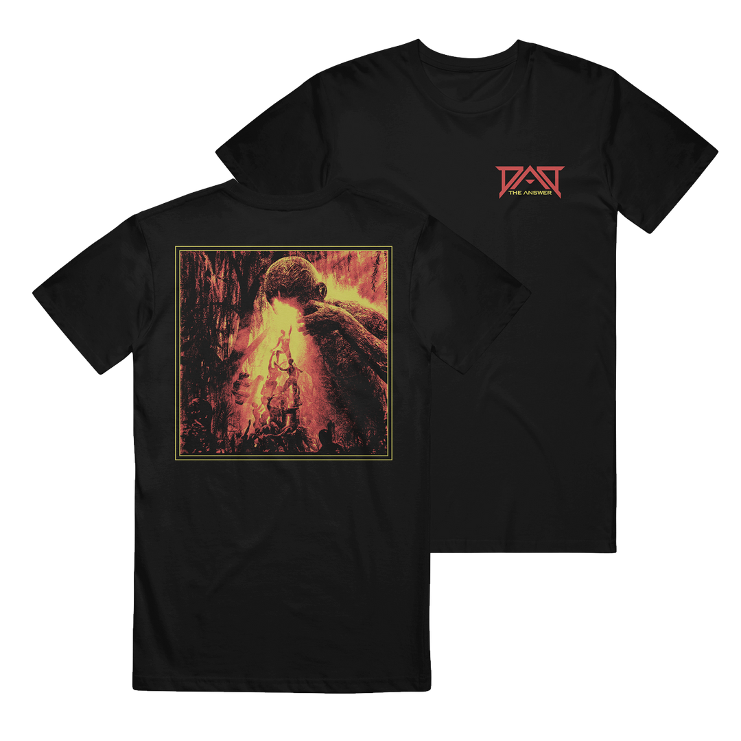 The Dead Air Divine classic black T-shirt is made from 100% cotton, featuring a red logo on the front left chest and striking fiery artwork on the back with a large creature towering over smaller figures in a dramatic scene.