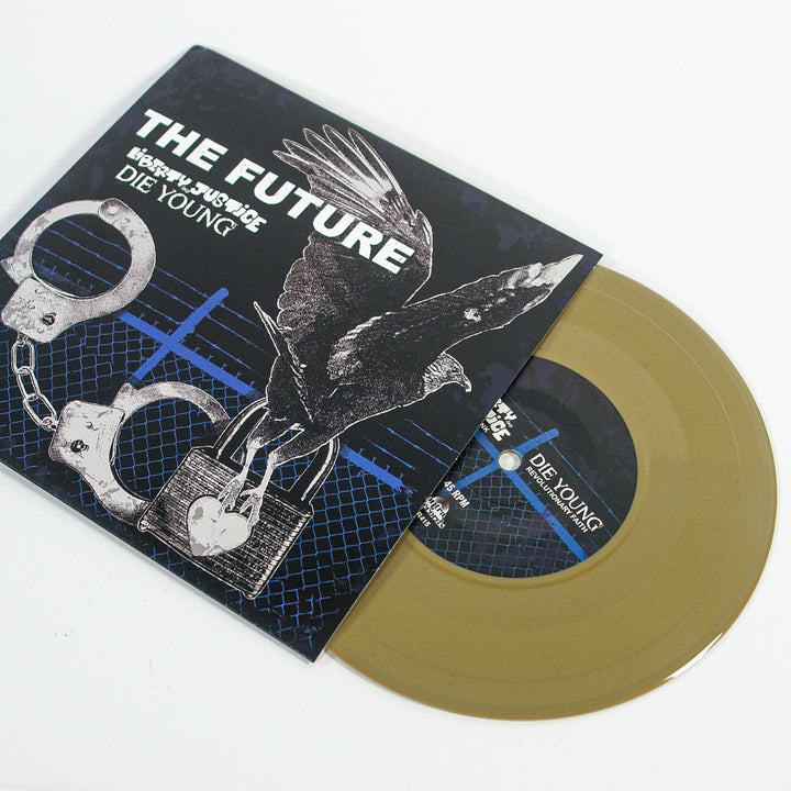 A gold vinyl record by Die Young, partially out of its sleeve, shows a crow with outstretched wings above a heart-shaped padlock and handcuffs. The sleeve’s text—THE FUTURE and DIE YOUNG—reflects Texas DIY hardcore roots.