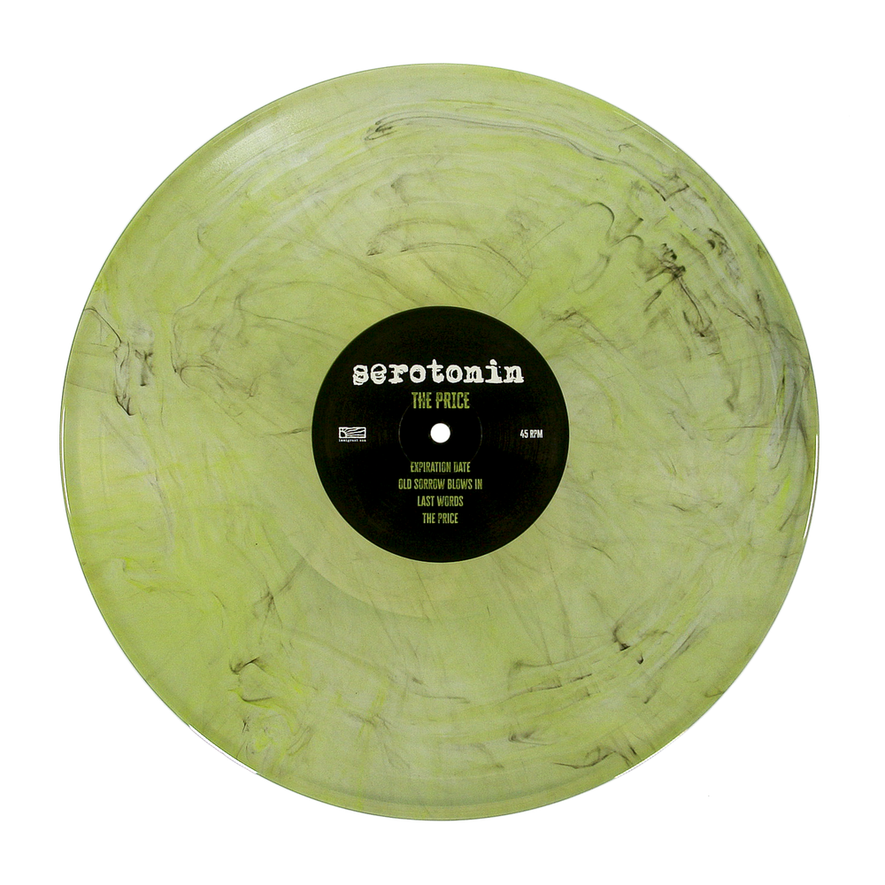 A translucent light green emo punk vinyl record with black marbling and a center label reading serotonin THE PRICE followed by a tracklist.