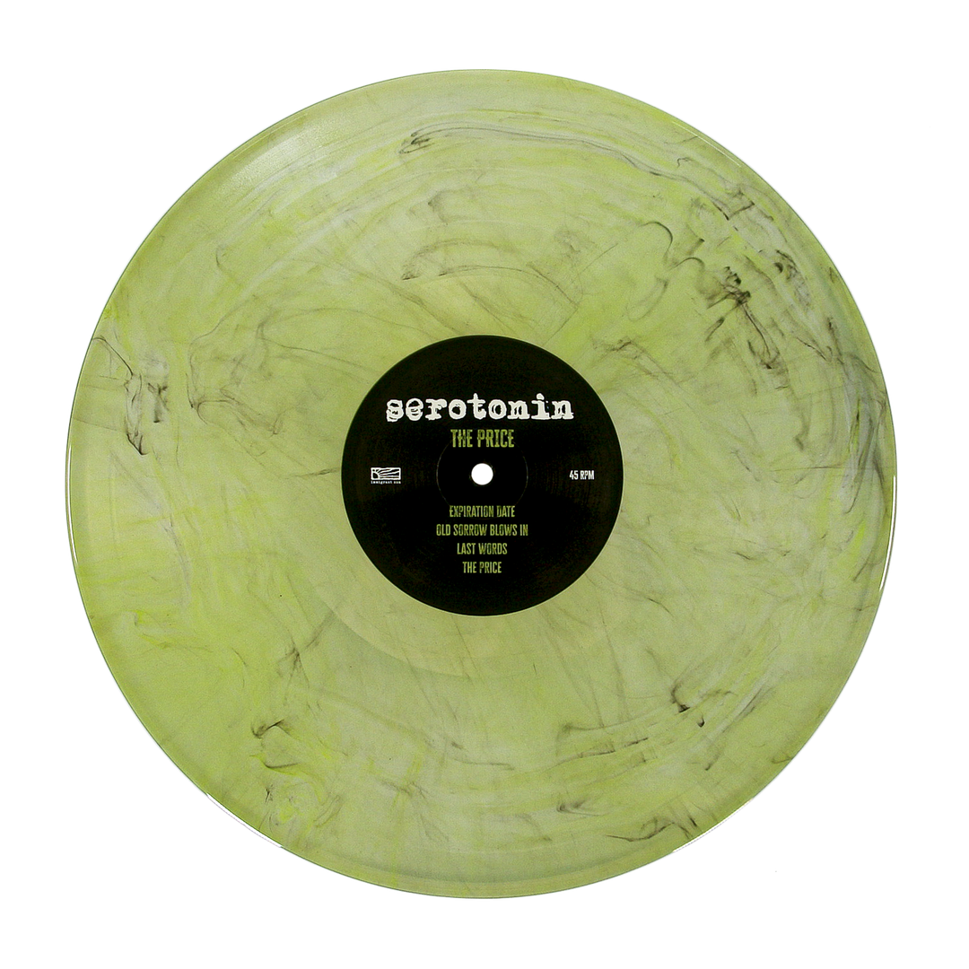 A translucent light green emo punk vinyl record with black marbling and a center label reading serotonin THE PRICE followed by a tracklist.