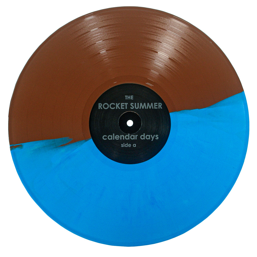 The Rocket Summer Calendar Days vinyl features a unique design: one half brown, the other bright blue. Its black center label displays “The Rocket Summer - calendar days - side a” in white text.